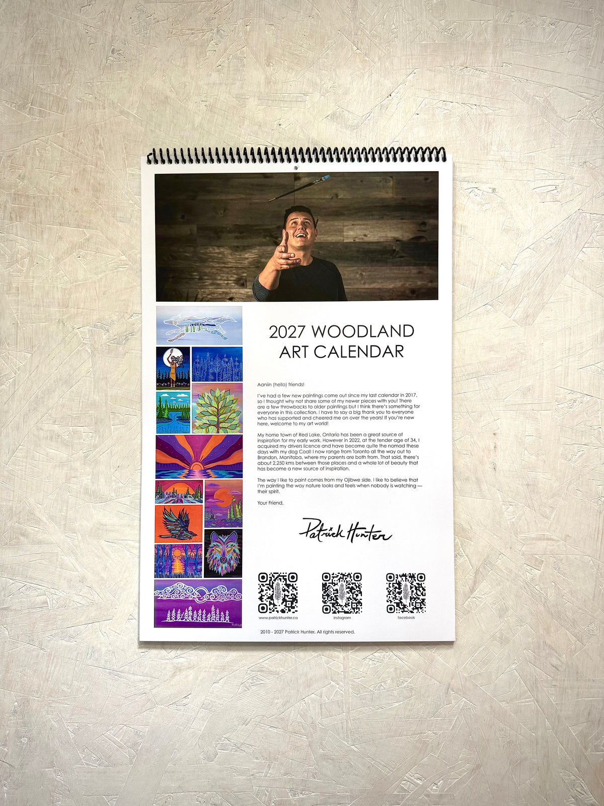 Back cover of Patrick's woodland art calendar with thumbnails of the 12 paintings that are included and details about Patrick.
