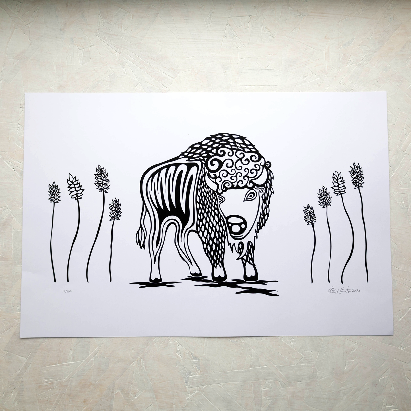 Print of Patrick Hunter's painting of a buffalo amongst tall prairie grass in black and white woodland art style.