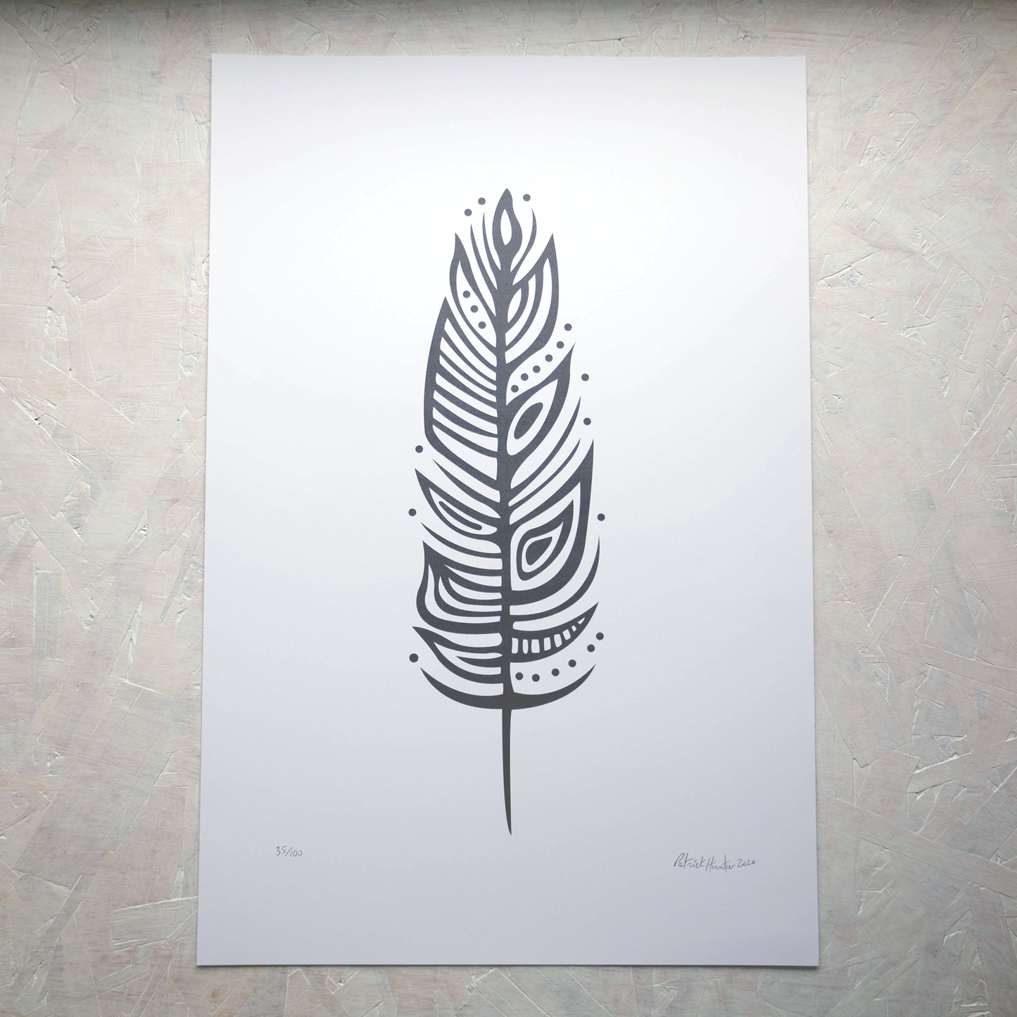 Print of Patrick Hunter's painting of an eagle feather in grey on white, woodland art style.
