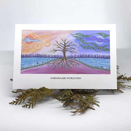 A greeting card with Patrick Hunter's Anishinaabe World View painting in woodland art style is displayed on some cedar boughs.