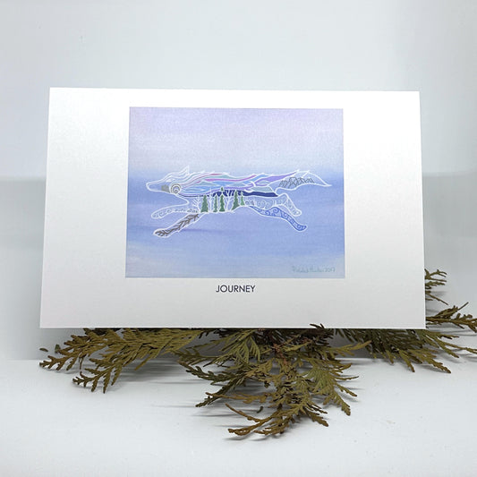 Patrick's artwork, Journey, as a greeting card, standing on cedar boughs.