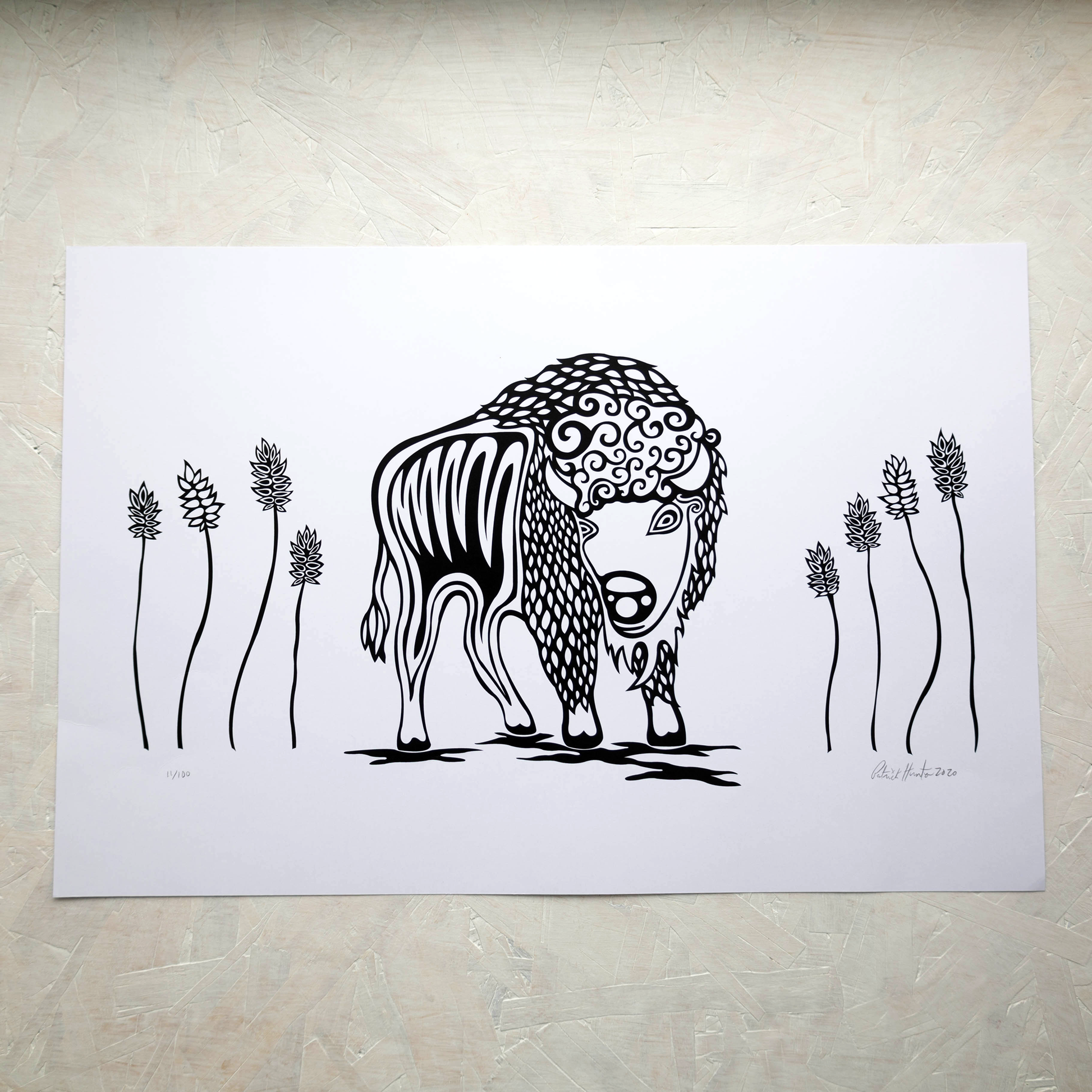 Print of Patrick Hunter's painting of a buffalo amongst tall prairie grass in black and white woodland art style.