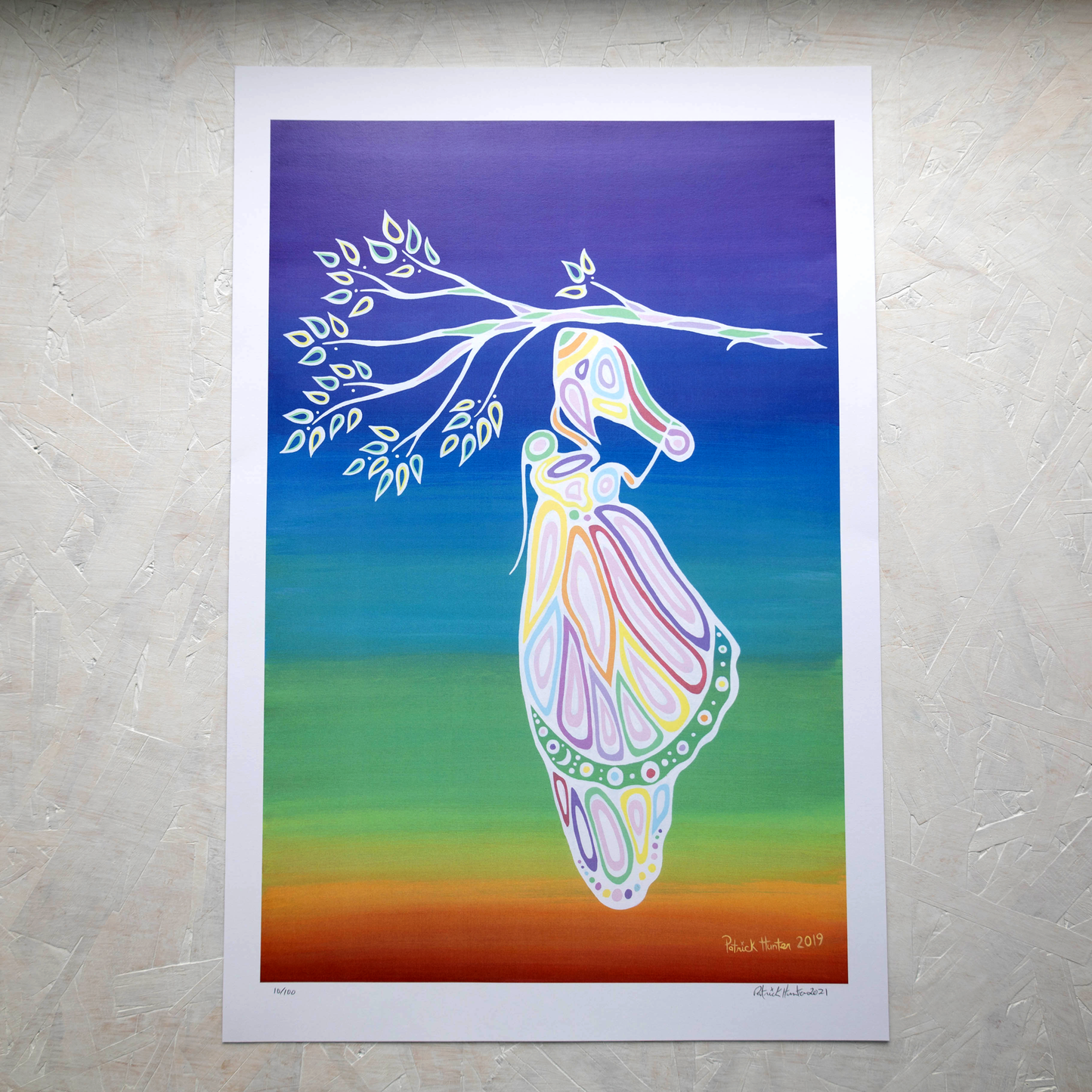 Print of Patrick Hunter's painting of a butterfly emerging from a cacoon on a rainbow gradient background in woodland art style.