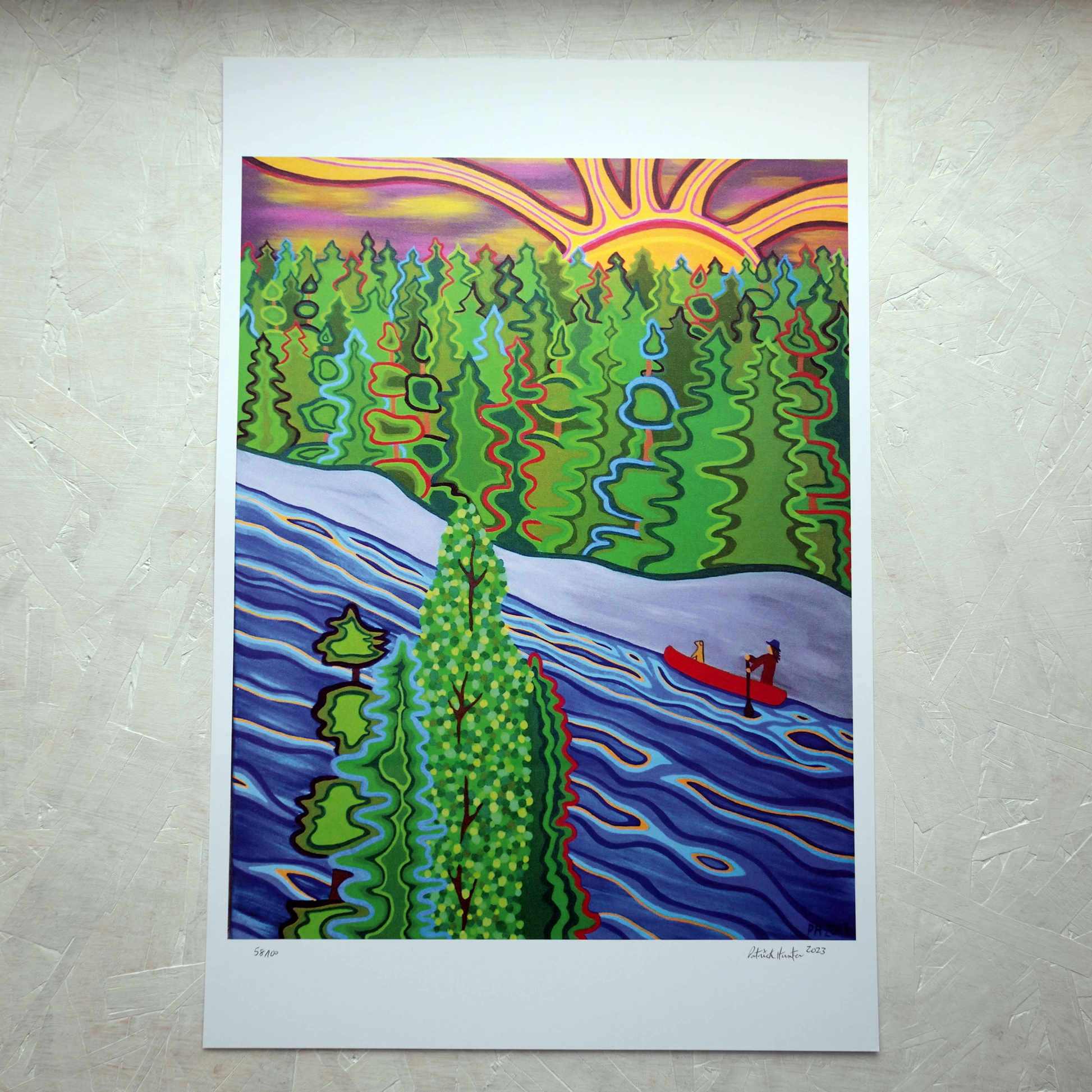 Print of Patrick Hunter's painting of a paddler with canine friend in a canoe on water with trees and sun, woodland art style.