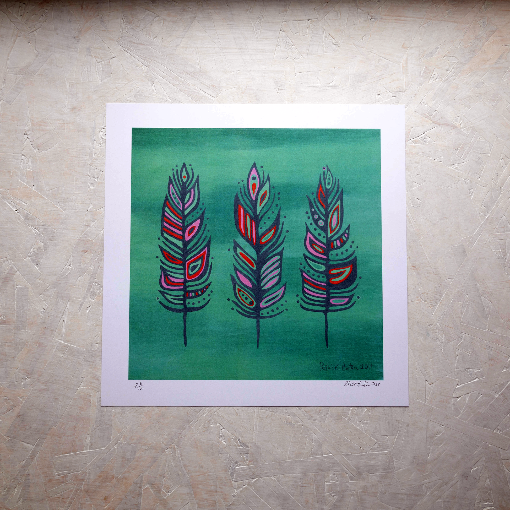 Print of Patrick Hunter's painting of three colourful feathers on varigated background woodland art style.