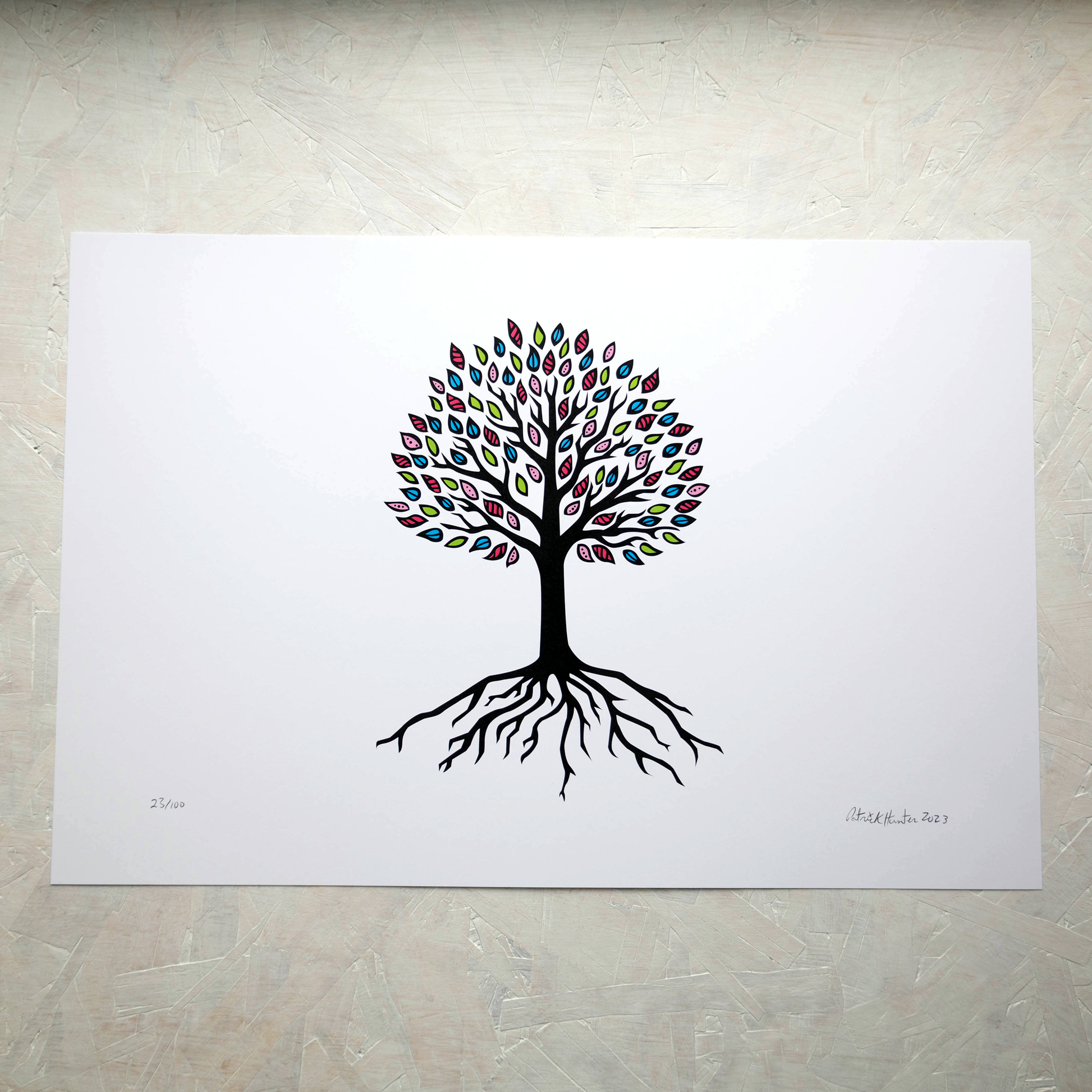 Print of Patrick Hunter's painting of a simplified tree of life, black on white with multicoloured leaves in landscape orientation, woodland art style.