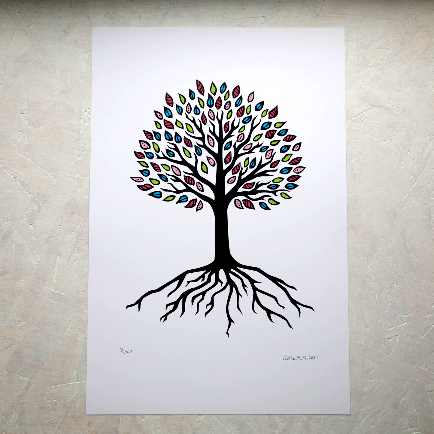 Print of Patrick Hunter's painting of a simplified tree of life, black on white with multicoloured leaves in portrait orientation, woodland art style.