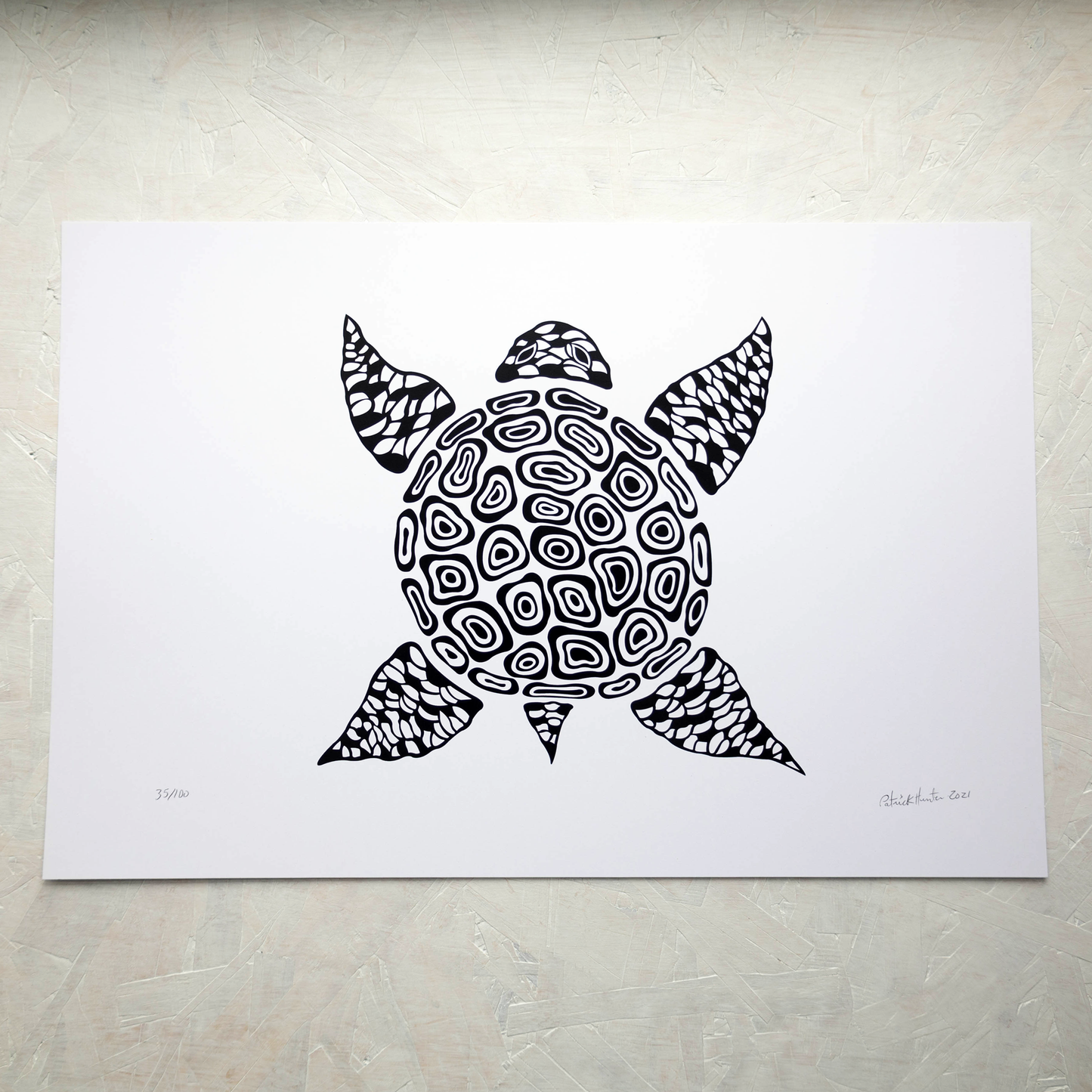 Print of Patrick Hunter's painting of a bird's eye view of a turtle, black on white, woodland art style.