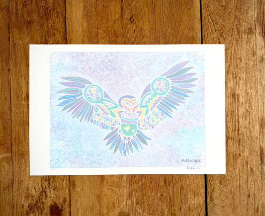 Patrick's print of original woodland art style owl with outstretched wings on white paper, against a wood grain background.