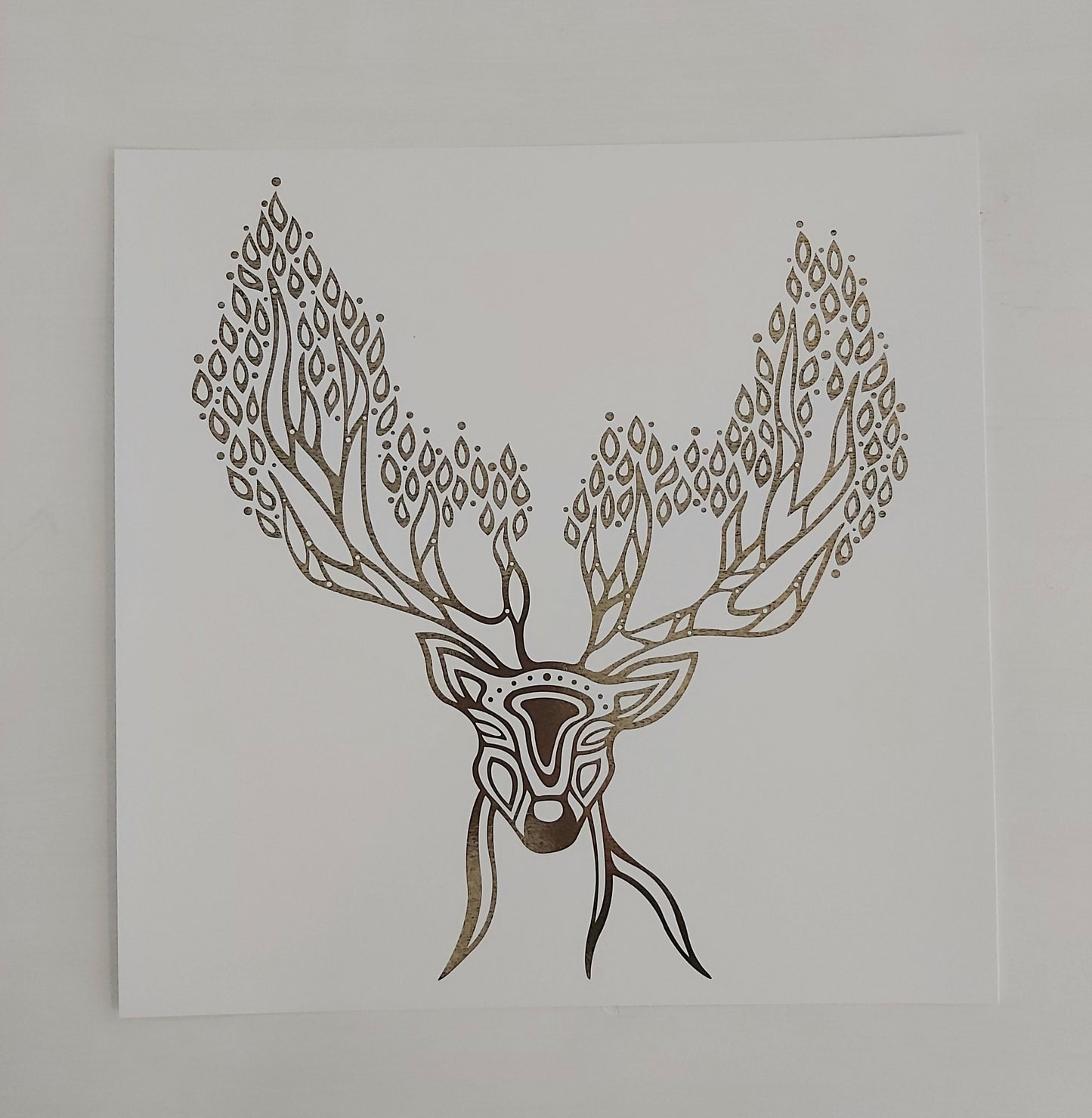 Print of Patrick Hunter's painting of a deer spirit in gold leaf on white in woodland art style.