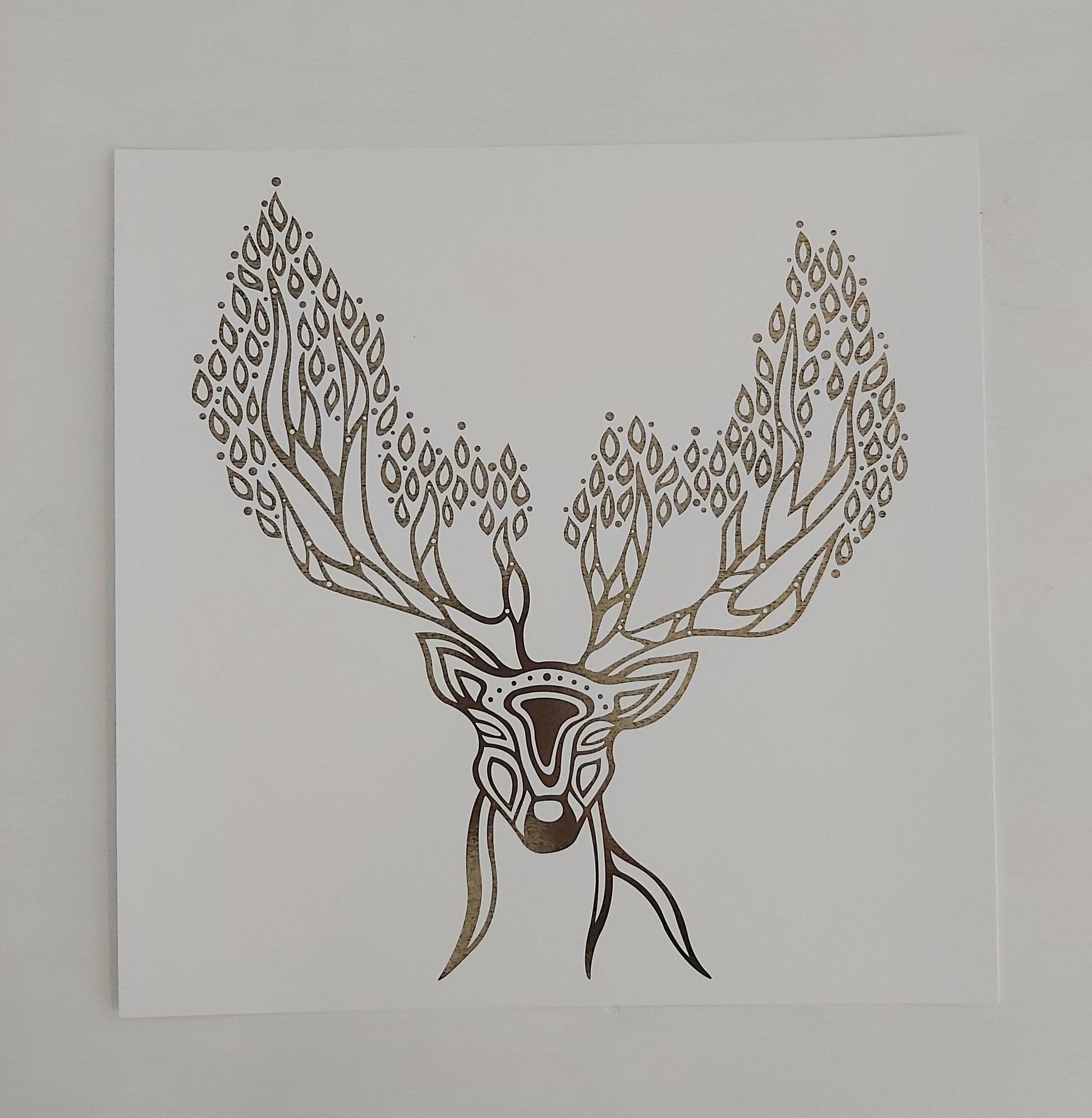 Print of Patrick Hunter's painting of a deer spirit in gold leaf on white in woodland art style.