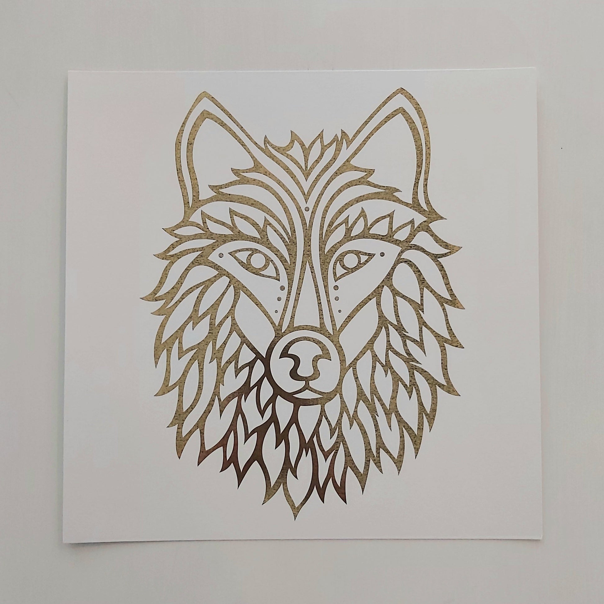 Print of Patrick Hunter's painting of a wolf, gold leaf on white, woodland art style.