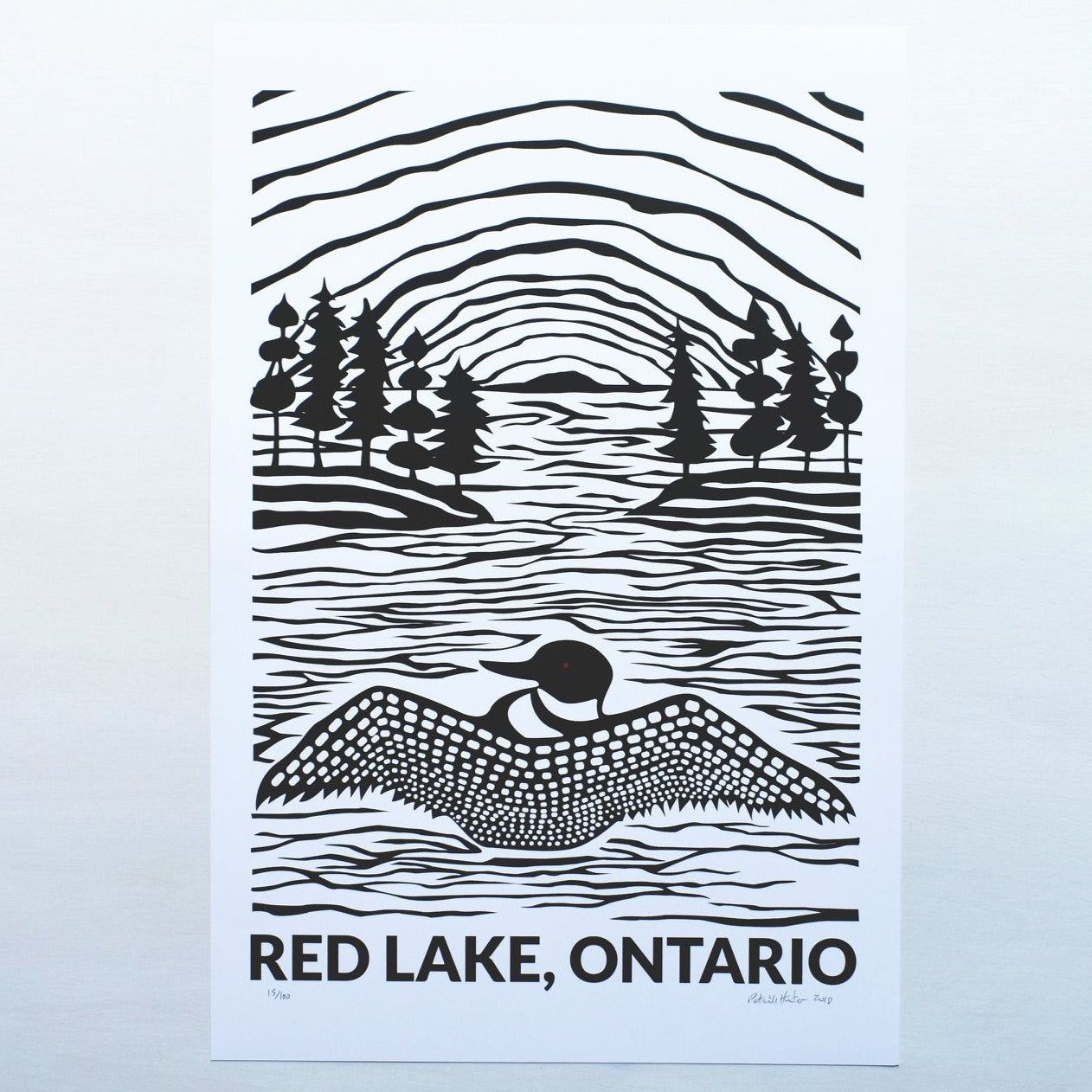 Print of Patrick Hunter's painting of a loon on a lake, black on white, woodland art style, above text reading Red Lake, Ontario.