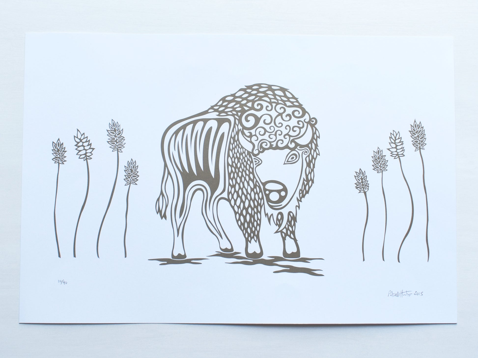 Print of Patrick Hunter's painting of a buffalo amongst tall prairie grass in gold and white woodland art style.